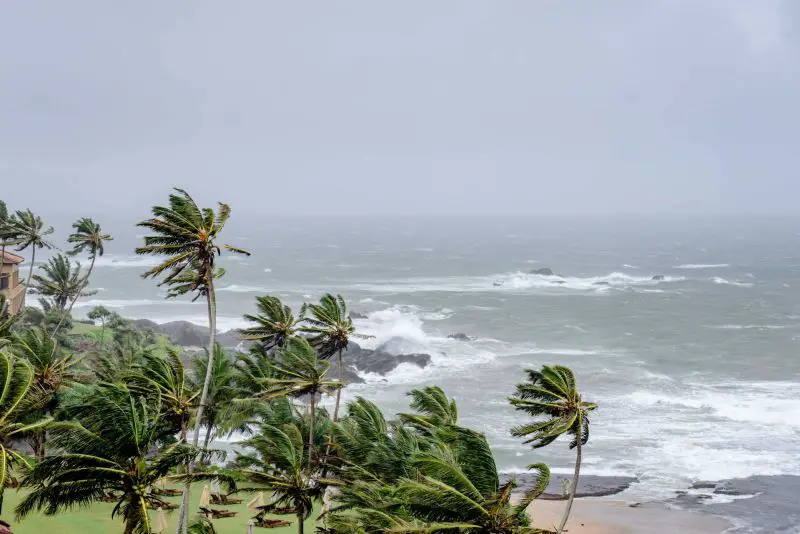 Strong winds and flooding sweep across Hawaii as leaders warn residents to stay off roads
