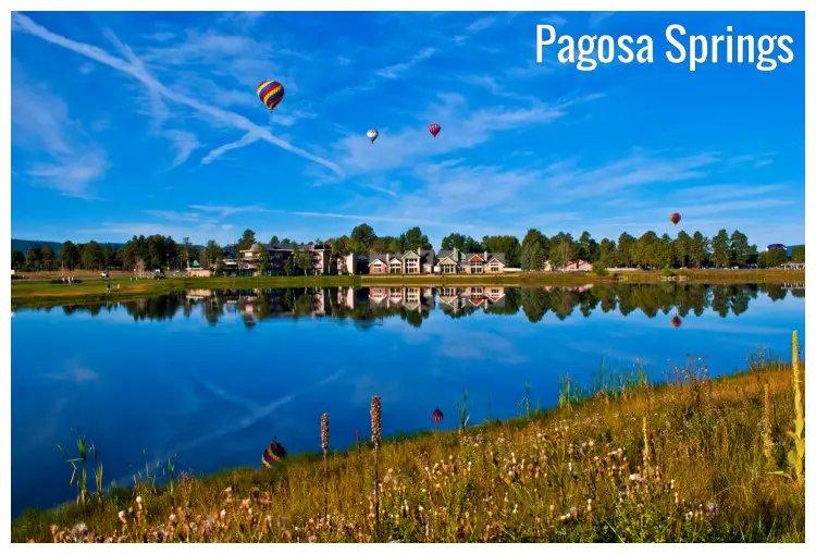 Scenic field and beautiful waterfront homes with a cute background in Pagosa Springs, Colorado Scenic field and beautiful waterfront homes with a cute background in Pagosa Springs, Colorado