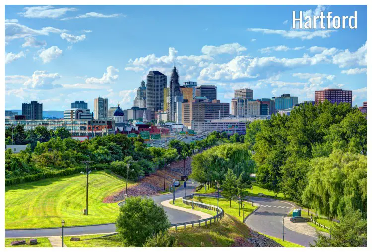 The city of Hartford, Connecticut with the roads leading to the town, and trees on roadsides