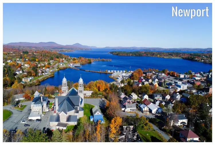 Beachside homes overlooking the calm, blue water of the sea out front in Newport, Vermont