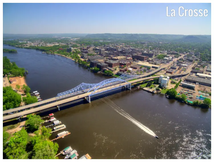 A scenic shot from above of La Crosse City in Wisconsin, with the view of the iconic Mississippi River and bridge A scenic shot from above of La Crosse City in Wisconsin, with the view of the iconic Mississippi River and bridge