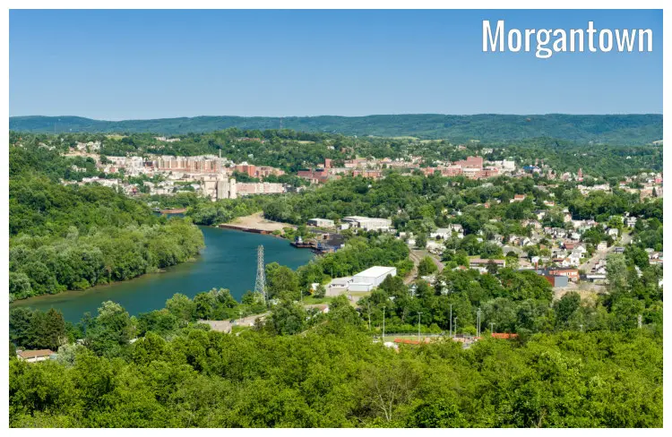 The green and leafy Morgantown City in West Virginia, with a view of the river and the iconic West Virginia University block The green and leafy Morgantown City in West Virginia, with a view of the river and the iconic West Virginia University block