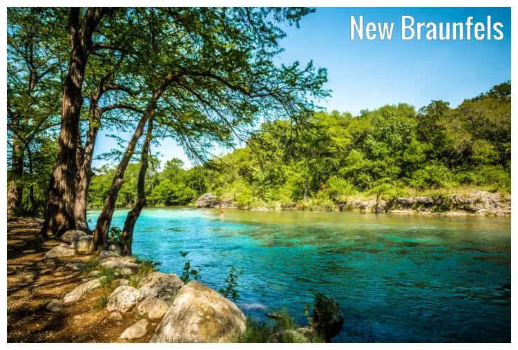 Rocks and scenic trees along both side of the shores on the calm Guadalupe River in New Braunfels, Texas Rocks and scenic trees along both side of the shores on the calm Guadalupe River in New Braunfels, Texas