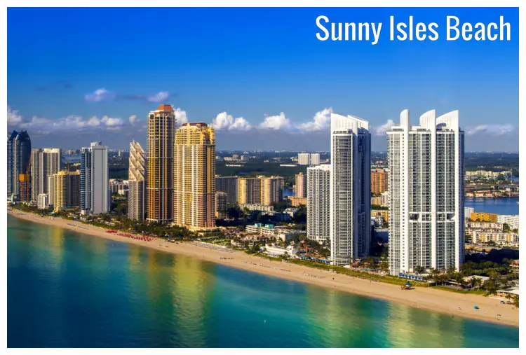 The stunning skyscrapers of the cityscape along the Sunny Isles Beach, Florida, with a scenic reflection in the ocean water The stunning skyscrapers of the cityscape along the Sunny Isles Beach, Florida, with a scenic reflection in the ocean water