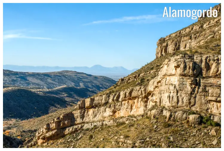 High rocks and cliffs on the slopes of a high hill overlooking the gorgeous Alamogordo Mountain ranges in New Mexico