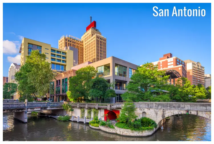 Buildings in San Antonio, Texas, with a calm view of the bridges across the waterfront Buildings in San Antonio, Texas, with a calm view of the bridges across the waterfront