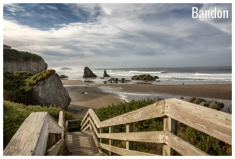 A wooden staircase pier, the pebbly and rocky coast of Bandon, Oregon A wooden staircase pier, the pebbly and rocky coast of Bandon, Oregon