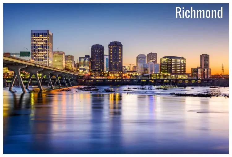 River James in Richmond, Virginia overlooking the lit city buildings at dusk