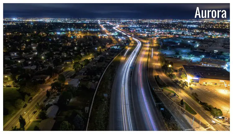 Beautiful city lights and speedy car lights on the highway in Aurora City, Colorado