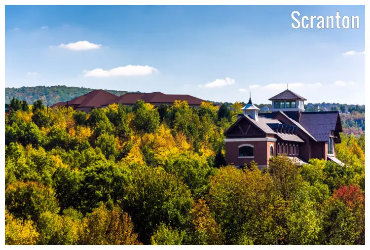 These houses are set in a hilly spot and circled by trees full of the beauty of the fall foliage on a typical day in the Scranton region of Pennsylvania These houses are set in a hilly spot and circled by trees full of the beauty of the fall foliage on a typical day in the Scranton region of Pennsylvania