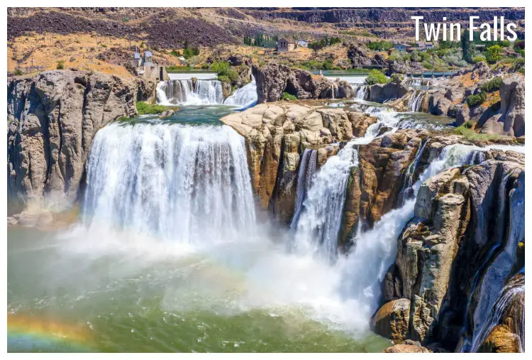 The high water of the Shoshone Falls in Twin Falls, Idaho, falling over the high rock cliffs and flowing into a river below
