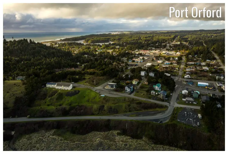 The intense road vein network and the dense tree cover in the scenic town of Port Orford, Oregon The intense road vein network and the dense tree cover in the scenic town of Port Orford, Oregon