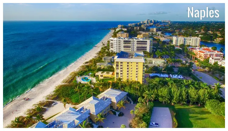 Magnificent white sandy shores of Naples in Florida, USA, complete with a view of the city structure and plantation Magnificent white sandy shores of Naples in Florida, USA, complete with a view of the city structure and plantation
