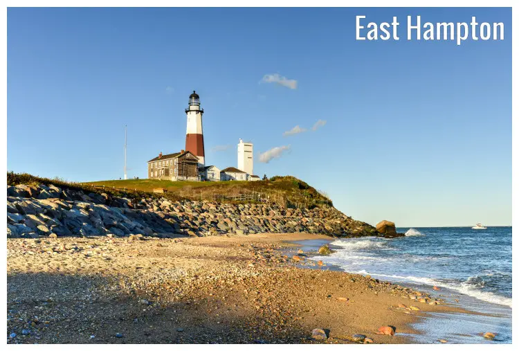 The very tall Montauk Point Lighthouse stands high on a hilly spot overlooking the rocky and pebbly shores of East Hampton in Long Island, New York The very tall Montauk Point Lighthouse stands high on a hilly spot overlooking the rocky and pebbly shores of East Hampton in Long Island, New York