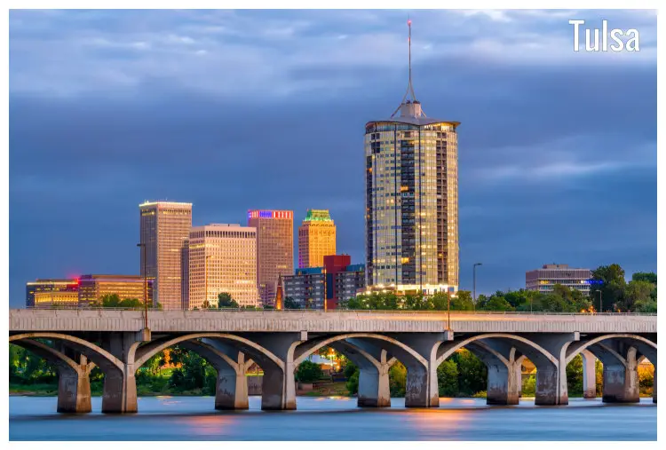 A bridge over the Arkansas River overlooking the scenic Tulsa city in Oklahoma A bridge over the Arkansas River overlooking the scenic Tulsa city in Oklahoma