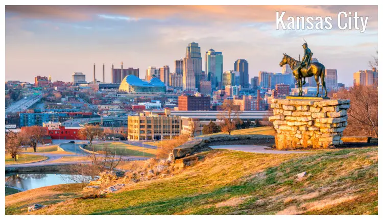 Panorama of Kansas City, Missouri in the US, with an old statue of a scout boy looking towards the city