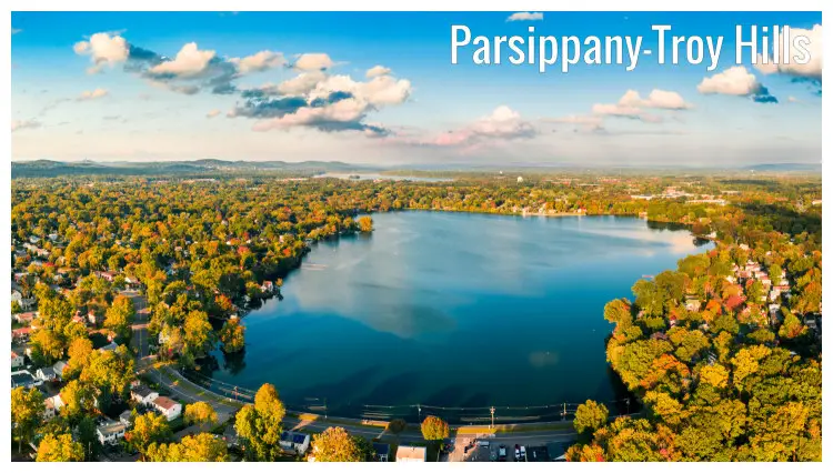 An aerial panorama of Parsippany City in the Troy Hills, New Jersey, with colorful brown and golden trees around the scenic Lake Parsippany