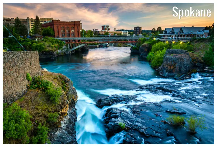 Rocks and cliffs around the scenic Spokane Falls in Washington, leading to the vast Spokane River and a view of the high bridge out front Rocks and cliffs around the scenic Spokane Falls in Washington, leading to the vast Spokane River and a view of the high bridge out front