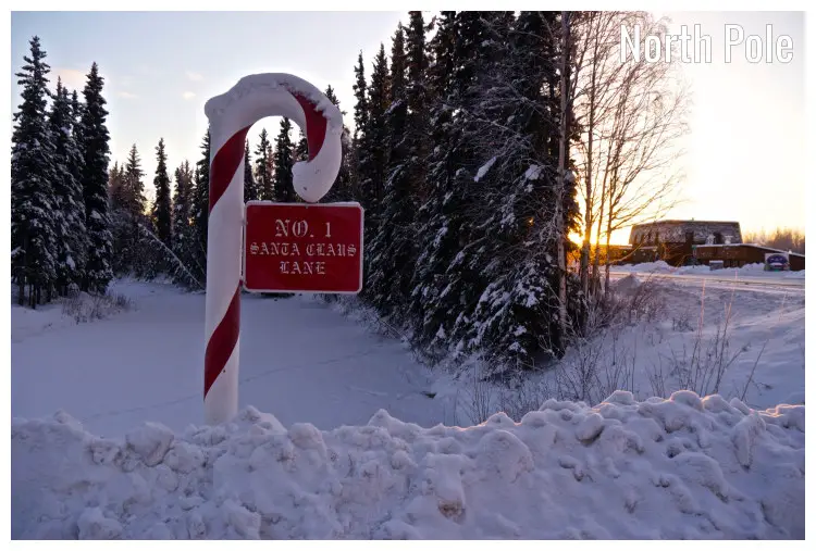 A snow-covered road sign on the Santa Clause Lane in the North Pole, Alaska