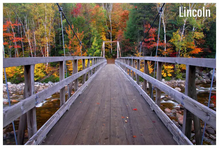 A beautiful autumn view of the Pemigewasset River footbridge in Lincoln, New Hampshire A beautiful autumn view of the Pemigewasset River footbridge in Lincoln, New Hampshire