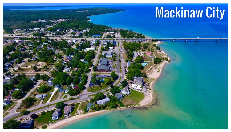 The lovely seaside Mackinaw City in Michigan, with a view of the intense road network therein and a part of the long Mackinac Bridge