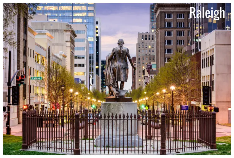The George Washington statue overlooking the city buildings of Raleigh, North Carolina