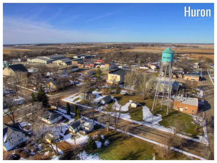 An old water tower stands high with a bold sign of the town name in the small farming town of Bryant near Huron, South Dakota. 