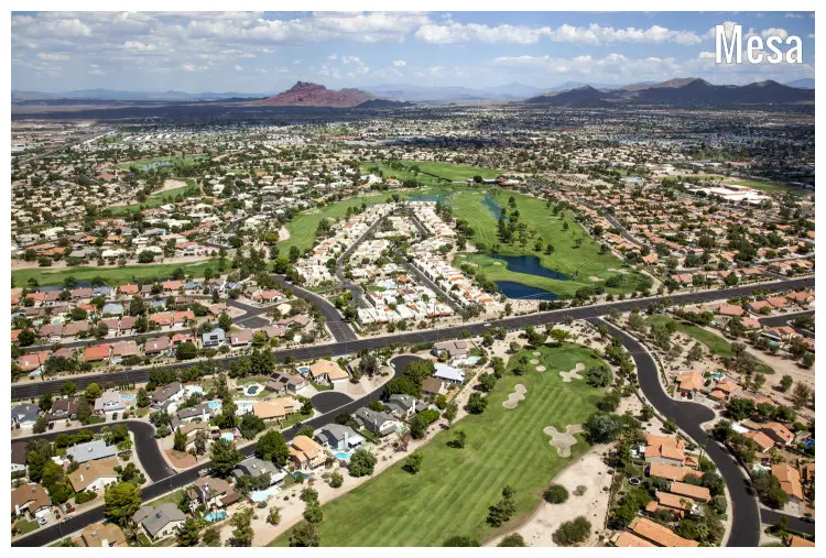 The scenic city of Mesa in Arizona, with a view of the famous well-manicured golf course near the Red Mountain range The scenic city of Mesa in Arizona, with a view of the famous well-manicured golf course near the Red Mountain range