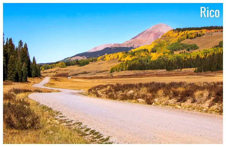 The hilly slopes of the Rocky Mountains in Rico, Colorado, beautiful yellow trees and distant bare hilltops