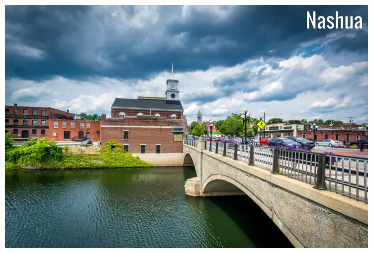 The arched Main Street Bridge crossing over the iconic Nashua River in New Hampshire