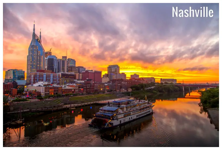 Overlooking the city buildings of Nashville, Tennessee, across the riverfront, with a big cruise ship ashore
