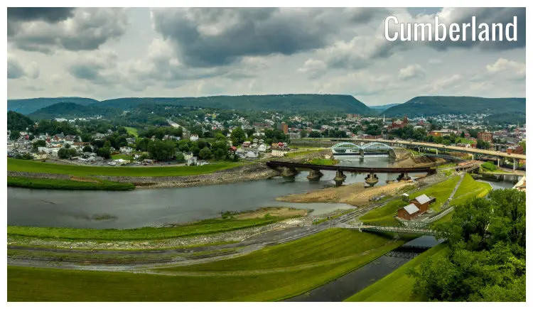 The scenic area of the town of Cumberland, Maryland, and a view of bridges over the Potomac River and a far hilly landscape The scenic area of the town of Cumberland, Maryland, and a view of bridges over the Potomac River and a far hilly landscape