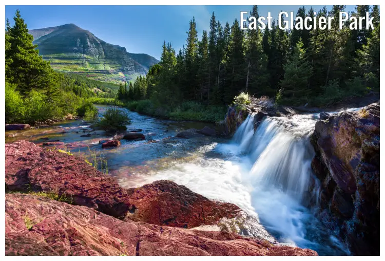 Colorful red cliffs and rocks, scenic pine forests, and far hills near the glorious white waterfall in the East Glacier Park, Montana Colorful red cliffs and rocks, scenic pine forests, and far hills near the glorious white waterfall in the East Glacier Park, Montana