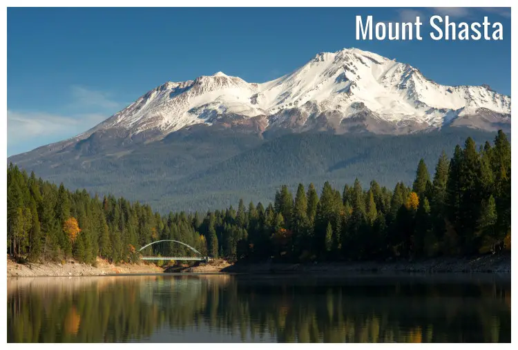 The Lake Siskiyou on the base of Mount Shasta in California, and a view of the planted forest, the far suspension bridge, and snowy mountain peak The Lake Siskiyou on the base of Mount Shasta in California, and a view of the planted forest, the far suspension bridge, and snowy mountain peak