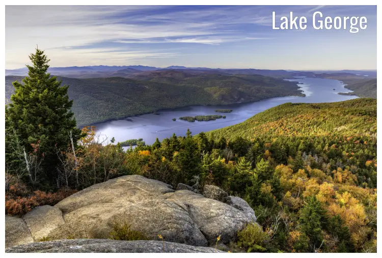 Lake George, New York, and the Tongue Mountain range viewed from atop a large rock in the Adirondack Mountains Lake George, New York, and the Tongue Mountain range viewed from atop a large rock in the Adirondack Mountains