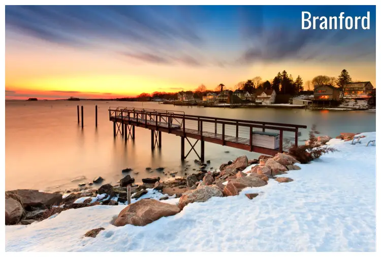 Snow on the rocks and a pier on the water of the famed Stony Creek in Brandford City, Connecticut Snow on the rocks and a pier on the water of the famed Stony Creek in Brandford City, Connecticut