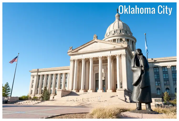 The State Capitol Building, Oklahoma City, Oklahoma, with flags and a statue outside The State Capitol Building, Oklahoma City, Oklahoma, with flags and a statue outside