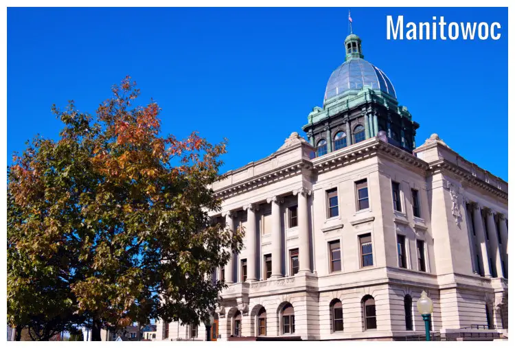 A tree outside of the iconic stone old courthouse in Manitowoc City, Wisconsin 