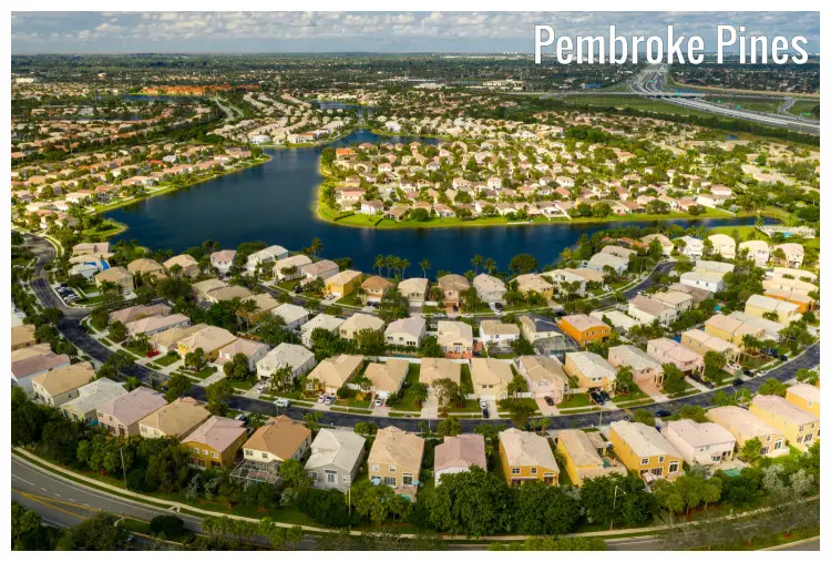 The neat modern residential estate in Pembroke Pines, Florida, with a view of the lake and road network
