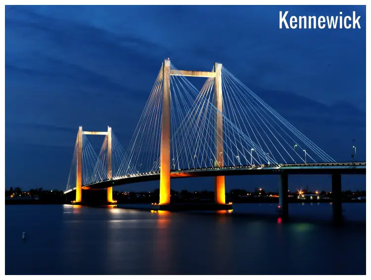 Yellow night lights on the pillars of the iconic Benton Franklin Intercounty Bridge passing over the Columbia River in Kennewick, Washington Yellow night lights on the pillars of the iconic Benton Franklin Intercounty Bridge passing over the Columbia River in Kennewick, Washington