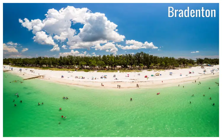 Beautiful clear water and white sand of the busy Coquina Beach in Brandenton, Florida