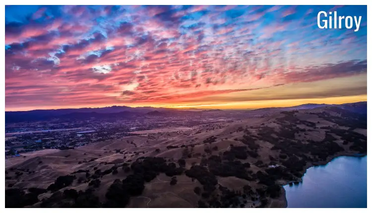 A colorful sunset sky over the hilly region of Gilroy in California A colorful sunset sky over the hilly region of Gilroy in California