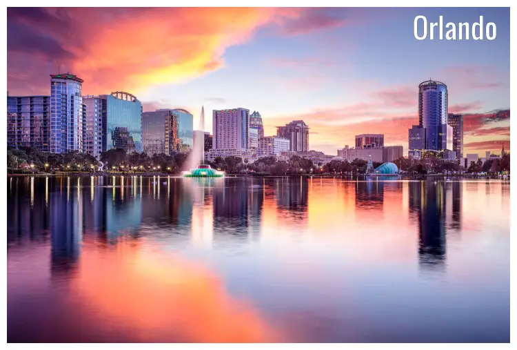 Colorful water reflection of Orlando city in Florida, USA, with its majestic skyscrapers Colorful water reflection of Orlando city in Florida, USA, with its majestic skyscrapers