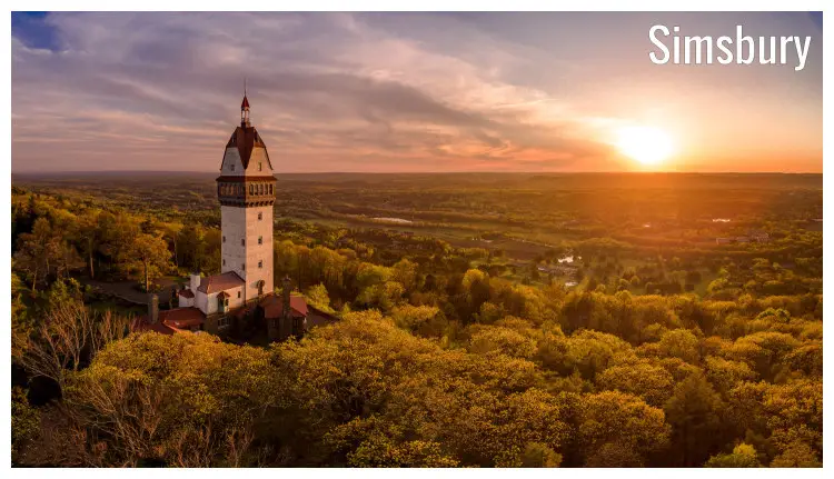 The iconic old tower set amid dense tree cover in Simsbury, Connecticut