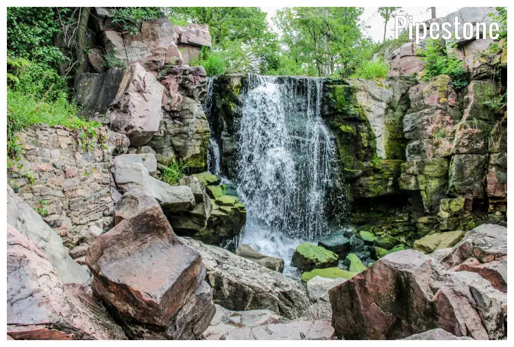 Water trickles down on high rocks and cliffs in the Winnewissa Falls in Pipestone, Minnesota