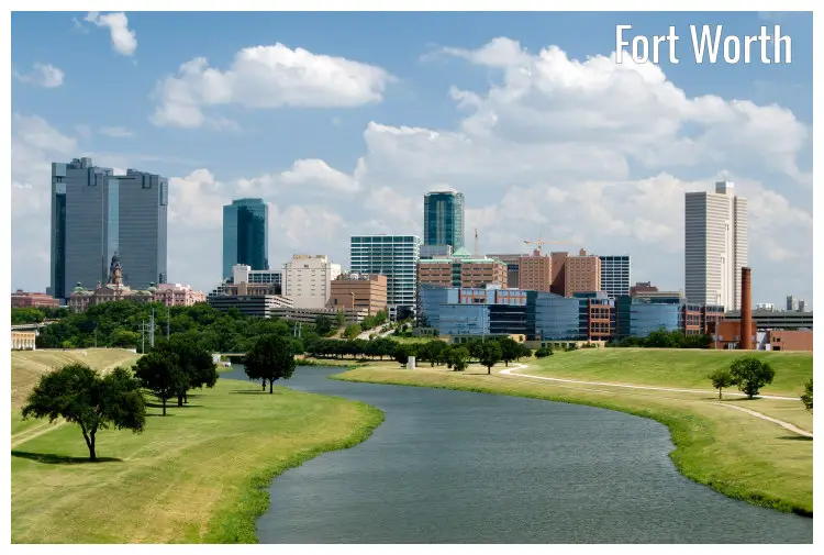 A calm river flowing down towards the beautiful cityscape of Fort Worth, Texas A calm river flowing down towards the beautiful cityscape of Fort Worth, Texas