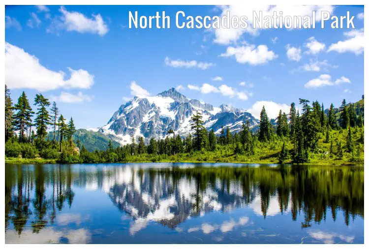 The lovely Picture Lake reflecting the trees on the shores and the distant Mount Shuksan in the North Cascades National Park, Washington, USA