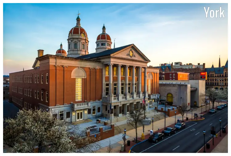 This courthouse of the York County, Pennsylvania, stands tall in the bright evening sunlight rays