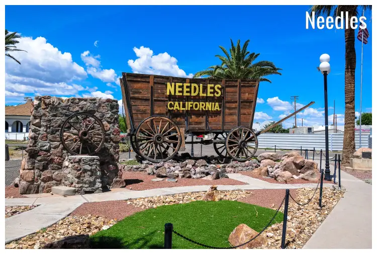 A beautiful creation featuring stones, neat paths, and a wheeled cart to welcome you to Needles in California