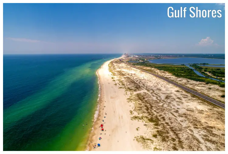 The road to Gulf Shores Beach in Alabama, besides the calm turquoise blue waters